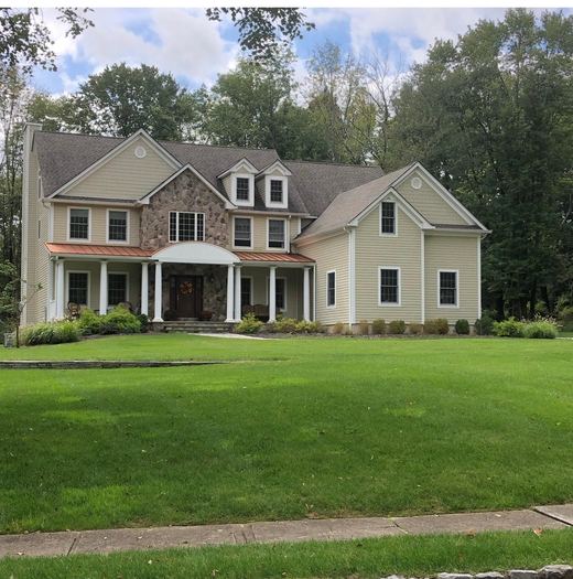 Stone colonial with copper-roofed covered porch — Storybook Homes NJ