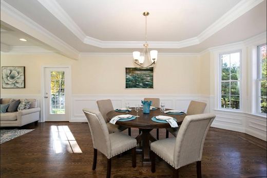 Living room with stone fireplace surround — Storybook Homes NJ