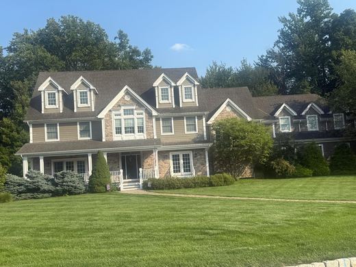 Brown-shingle colonial with multiple dormers and stone entry — Storybook Homes NJ