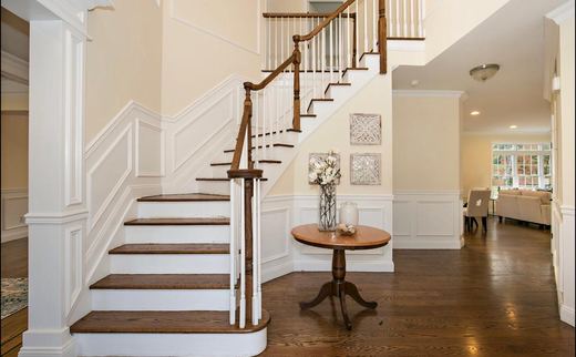 Foyer staircase with entry table — Storybook Homes NJ